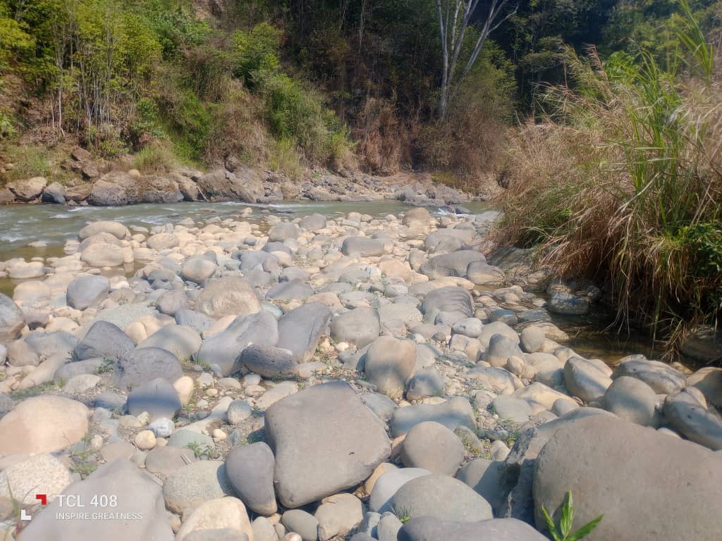 A rocky riverbed with low water levels in Kun Valley