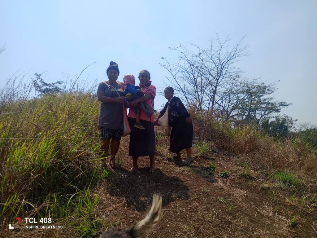 Family members walking together along a path through Kun Valley